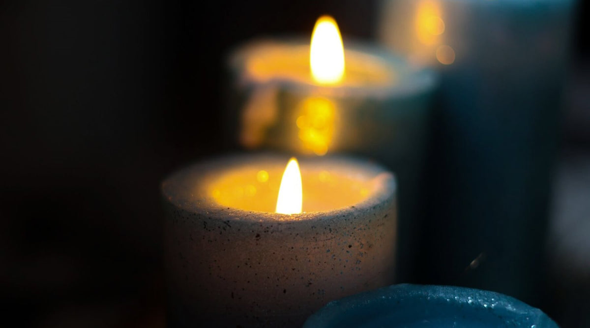 close-up of burning candles for a guide asking are candles and diffusers safe for cats